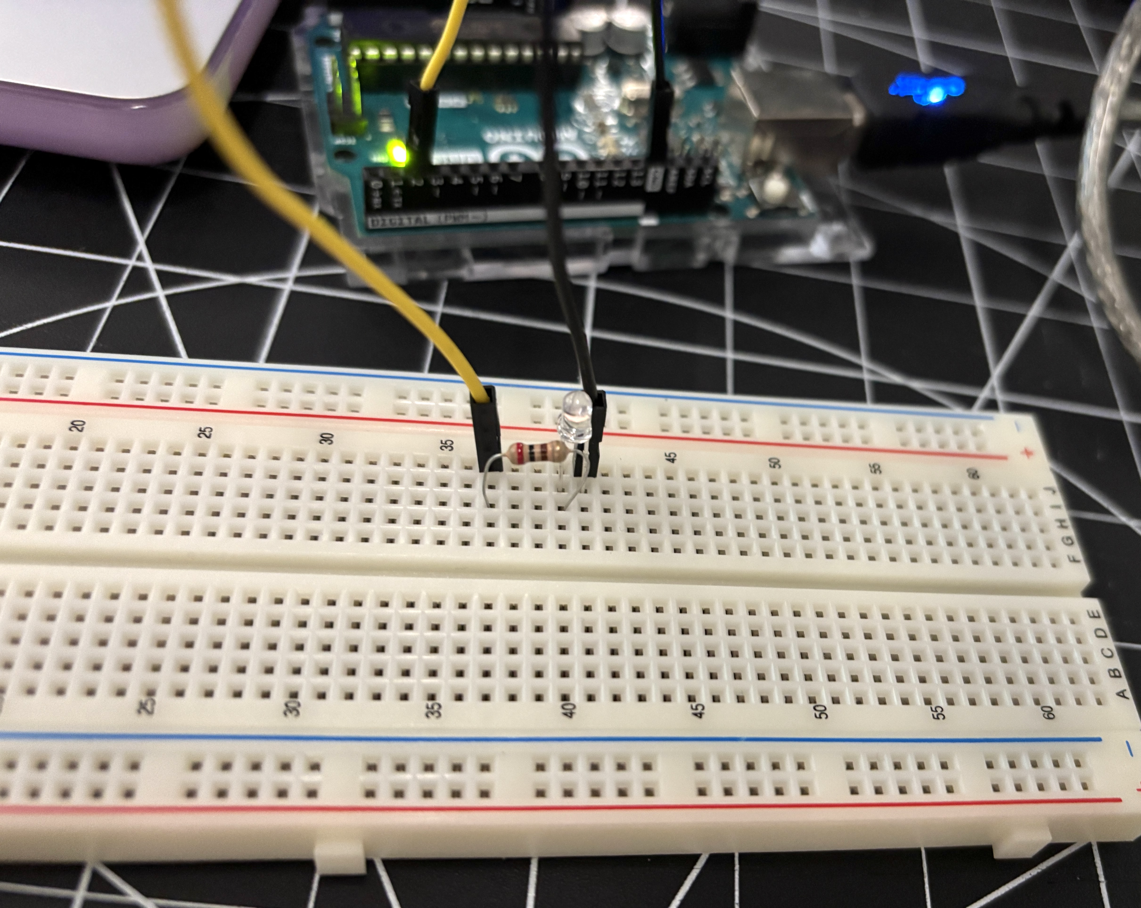 <b>Adding in a resistor</b><br>Here we shifted the voltage from 5V to 3.3V using a 200 Ohm resistor, connecting it to the same LED and wires we used earlier.